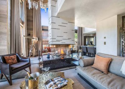 The living room at the Luxury ski-in ski-out chalet for large group chalet Perce Neige for 14 adults and 4 children with pool and a chef to rent in Courchevel 1850 with In-Luxe Chalets France