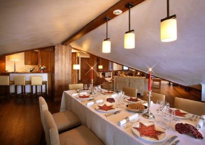 Dining area view Luxury ski-in ski-out apartment rental Loft 6 for 4 adults and 2 children with services, breakfast, a Spa, to rent in Courchevel 1650 with In-Luxe Chalets France